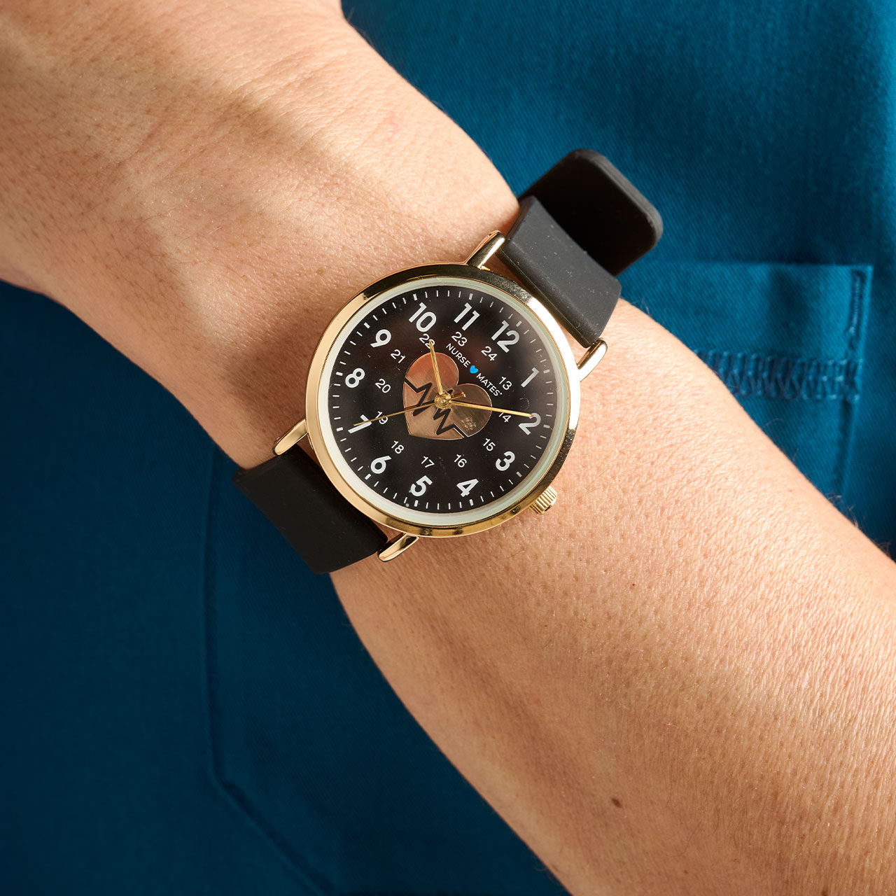 Woman wearing the Heart of Gold Watch on wrist.