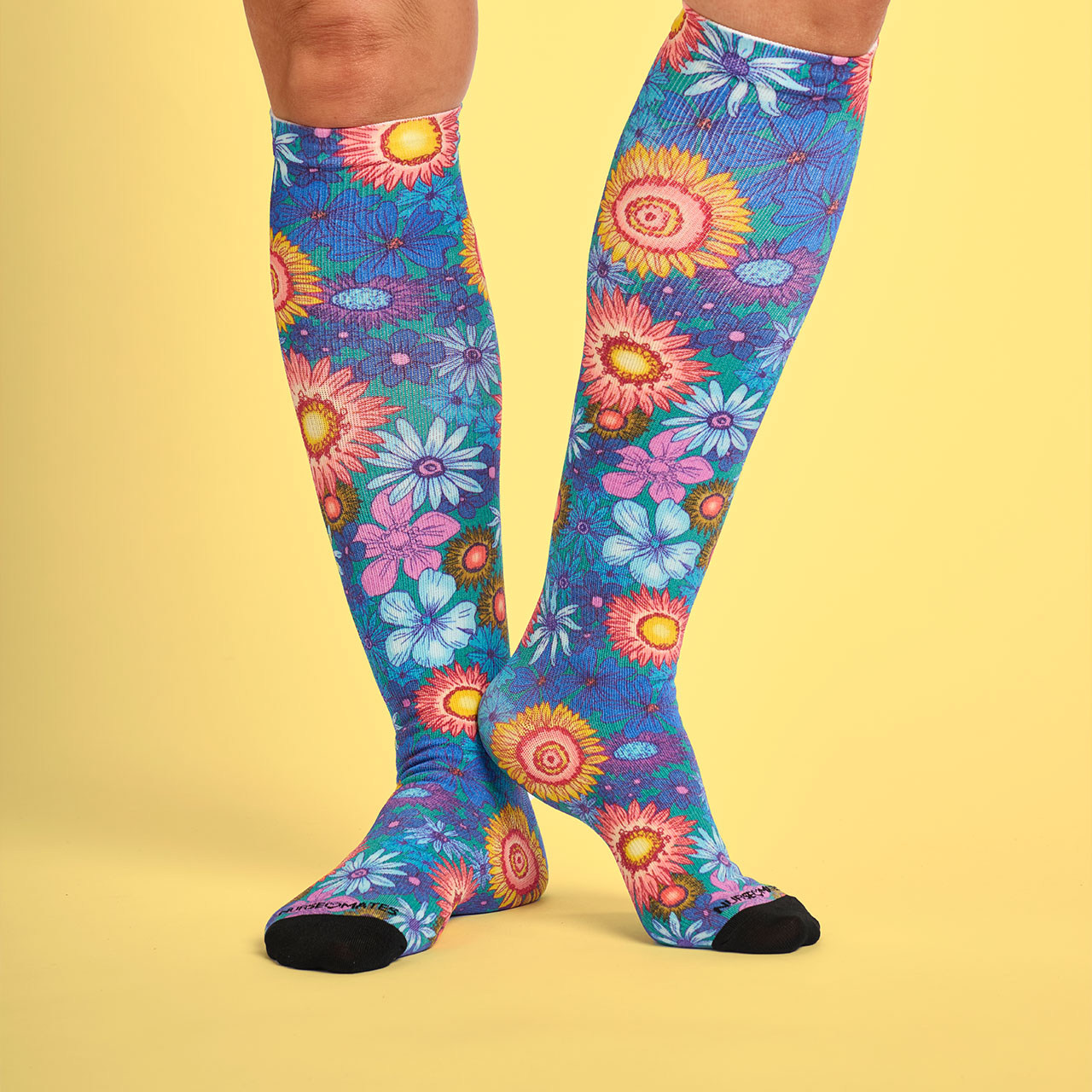 Woman wearing Compression Socks 360 in color "Botanical Gardens".