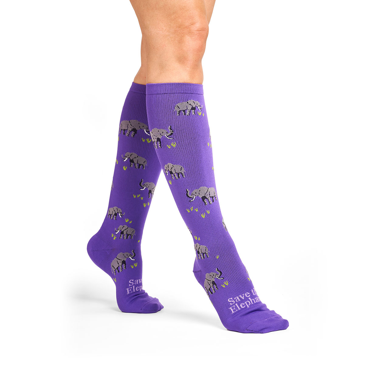 Woman with "Save the Elephants" purple Endangered Species Compression socks on foot.